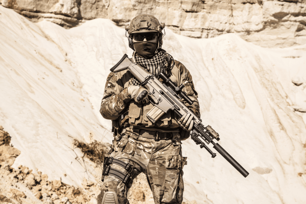 An army ranger in uniform standing with a determined expression
